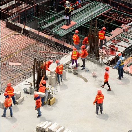Construction crew working on a reinforced concrete slab