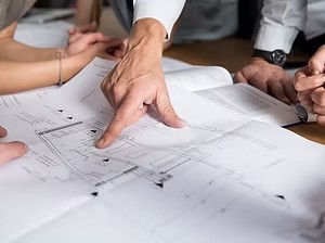 Engineers reviewing construction drawings